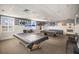 Spacious game room featuring pool tables, seating, and nautical-themed decorations at 4414 Mount Vernon Dr # 1, Bradenton, FL 34210