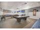 Bright game room boasting multiple pool tables and comfortable seating areas at 4414 Mount Vernon Dr # 1, Bradenton, FL 34210