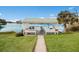 Charming lakeside gazebo with seating, offering a relaxing spot to enjoy the tranquil water views and serene surroundings at 4414 Mount Vernon Dr # 1, Bradenton, FL 34210