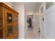 Bright hallway with tile flooring, bi-fold closet, and a glimpse into the living area at 4414 Mount Vernon Dr # 1, Bradenton, FL 34210