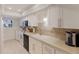Well-lit kitchen featuring white cabinets, modern appliances, and sleek countertops at 4414 Mount Vernon Dr # 1, Bradenton, FL 34210