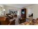 A spacious living room featuring comfortable leather seating and a sunroom filled with light at 4414 Mount Vernon Dr # 1, Bradenton, FL 34210