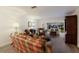 Comfortable living area with wood floors, cozy armchairs, and a bright sunroom offering outdoor views at 4414 Mount Vernon Dr # 1, Bradenton, FL 34210