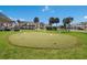 A well-maintained putting green with flags offers a recreational amenity for residents at 4414 Mount Vernon Dr # 1, Bradenton, FL 34210