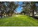 Scenic walking path winding through green lawns and mature trees at 4414 Mount Vernon Dr # 1, Bradenton, FL 34210