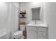 Bright bathroom with a shower-tub combo, floating shelves, and a neutral color palette at 4728 Old Blush St, Bradenton, FL 34211