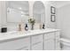 Bright bathroom featuring double sinks, gold hardware, and modern mirrors at 4728 Old Blush St, Bradenton, FL 34211