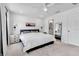 Bright and airy bedroom with a large window, light walls, carpeted floor, and an ensuite bath at 4728 Old Blush St, Bradenton, FL 34211