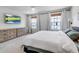 Spacious bedroom featuring lots of natural light, neutral walls, carpeted floors, and a TV at 4728 Old Blush St, Bradenton, FL 34211
