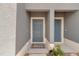 Entrance to townhouses with a covered entryway and inviting blue front doors at 4728 Old Blush St, Bradenton, FL 34211