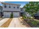 Charming two-story townhome with attached garage, beautiful landscaping, and inviting curb appeal at 4728 Old Blush St, Bradenton, FL 34211