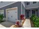 A welcoming townhome featuring a garage, front door, and tasteful landscaping for a cozy entrance at 4728 Old Blush St, Bradenton, FL 34211