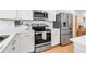 Well-equipped kitchen features stainless steel appliances, white cabinets, and sleek countertops at 4728 Old Blush St, Bradenton, FL 34211