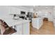 Open-concept kitchen with island, stainless steel appliances, and lots of cabinet space at 4728 Old Blush St, Bradenton, FL 34211