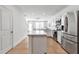 Modern kitchen with stainless steel appliances, island, and open-concept layout at 4728 Old Blush St, Bradenton, FL 34211