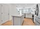 Contemporary kitchen with stainless steel appliances, island, and light hardwood floors at 4728 Old Blush St, Bradenton, FL 34211