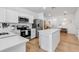 Open-concept kitchen with island, stainless steel appliances, and lots of cabinet space at 4728 Old Blush St, Bradenton, FL 34211