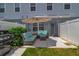 Cozy patio featuring a stylish wicker seating set with plush cushions, ideal for relaxing and enjoying the outdoors at 4728 Old Blush St, Bradenton, FL 34211