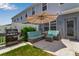 Charming outdoor patio with comfortable seating, a grill, and lush greenery, perfect for relaxation and entertaining at 4728 Old Blush St, Bradenton, FL 34211