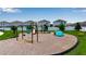 Community playground with swings, slides, and play equipment, perfect for to enjoy at 4728 Old Blush St, Bradenton, FL 34211