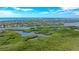 Breathtaking aerial view showcasing a lush community near the ocean with waterfront properties and stunning vistas at 4761 Pine Harrier Dr, Sarasota, FL 34231