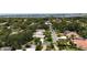 Aerial view of neighborhood featuring mature trees, well-maintained homes, and street view at 4761 Pine Harrier Dr, Sarasota, FL 34231