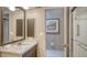 Bathroom showcasing a granite vanity, framed mirror and a glass-enclosed shower at 4761 Pine Harrier Dr, Sarasota, FL 34231