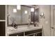 Well-lit bathroom featuring a vanity with a framed mirror, and decorative accents at 4761 Pine Harrier Dr, Sarasota, FL 34231