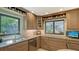 Well-appointed kitchen features granite countertops, stainless steel appliances, and ample cabinet space at 4761 Pine Harrier Dr, Sarasota, FL 34231