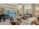 Spacious living room features a fireplace, large windows, and comfortable seating at 4761 Pine Harrier Dr, Sarasota, FL 34231
