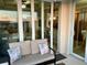 Inviting balcony with comfortable seating and sliding glass doors offers scenic views at 500 San Lino Cir # 534, Venice, FL 34292
