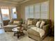 Comfortable living room featuring neutral tones and a cozy chaise lounge at 500 San Lino Cir # 534, Venice, FL 34292