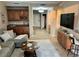 Open-concept living room features tile floors, a wet bar, and access to the home's entry at 500 San Lino Cir # 534, Venice, FL 34292
