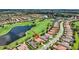 Aerial view of beautiful home in golf community with lake views and lush landscaping at 5104 Benito Ct, Bradenton, FL 34211