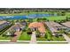 Stunning lakefront home with lush landscaping, tile roof and golf course views in a desirable community at 5104 Benito Ct, Bradenton, FL 34211