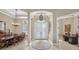 Grand foyer with a high ceiling, decorative chandelier, and elegant double doors at 5104 Benito Ct, Bradenton, FL 34211