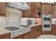 Gourmet kitchen with stainless steel appliances, granite countertops, and custom cabinetry at 5104 Benito Ct, Bradenton, FL 34211