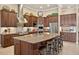 Gourmet kitchen with a large island, granite countertops, stainless steel appliances, and custom cabinetry at 5104 Benito Ct, Bradenton, FL 34211