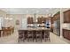 Gourmet kitchen with granite countertops, stainless steel appliances, and custom cabinetry at 5104 Benito Ct, Bradenton, FL 34211