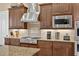Gourmet kitchen with granite countertops, stainless steel appliances, and custom cabinetry at 5104 Benito Ct, Bradenton, FL 34211