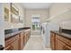 Laundry room boasts ample countertop space, cabinetry, a washer and dryer, and natural light at 5104 Benito Ct, Bradenton, FL 34211