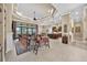 Spacious open-concept living room with seamless flow to kitchen and panoramic views of the outdoors at 5104 Benito Ct, Bradenton, FL 34211