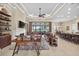 Bright living room with fireplace, tv, shelving, and sliding doors that open to the outside at 5104 Benito Ct, Bradenton, FL 34211