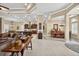 Bright living room with dining area and kitchen featuring an open concept and tile floors at 5104 Benito Ct, Bradenton, FL 34211