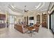 Spacious living room features tile floors, coffered ceilings, a fireplace, and built-in shelving at 5104 Benito Ct, Bradenton, FL 34211