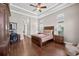 Spacious main bedroom with a tray ceiling, wood floors, and natural light at 5104 Benito Ct, Bradenton, FL 34211