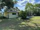 Exterior view of backyard showing the screen lanai and wooden fence at 5350 Barbarossa Ave, Sarasota, FL 34235