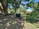 Large backyard with a double gate, bordered by a wood fence at 5350 Barbarossa Ave, Sarasota, FL 34235