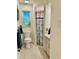 Hall bathroom featuring tile floors, a window and a walk-in shower at 5350 Barbarossa Ave, Sarasota, FL 34235