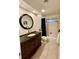 Bathroom with a vanity sink, a large mirror, and shower-tub combo at 5350 Barbarossa Ave, Sarasota, FL 34235